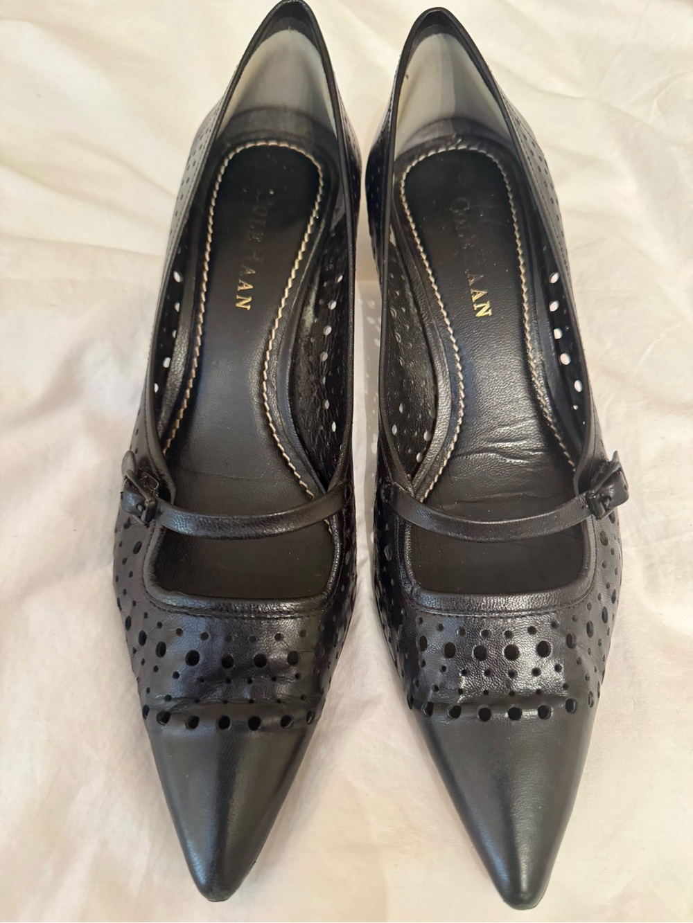 Cole Haan black leather perforated kitten heels with strap. Pointed toe. Size 8.